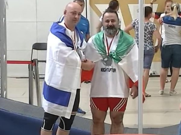 Iranian weightlifter is given lifetime ban by Islamic regime after he shook hands with Israeli competitor at international event