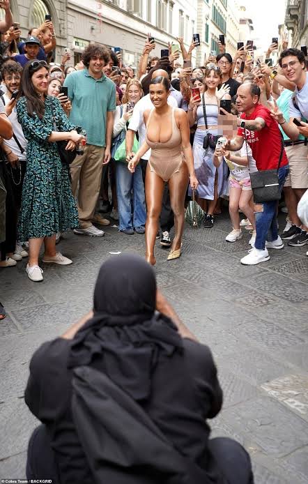 Kanye West and Bianca Censori cause a frenzy in Florence as rapper directs his wife to pose in front of excited locals (photos)
