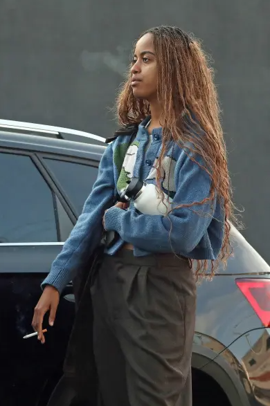 Malia Obama seen smoking in public weeks after younger sister Sasha was pictured smoking