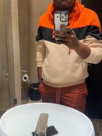 Nigerian Man Puts iPhone 15 Pro Max In Hot Water To Test Its Strength