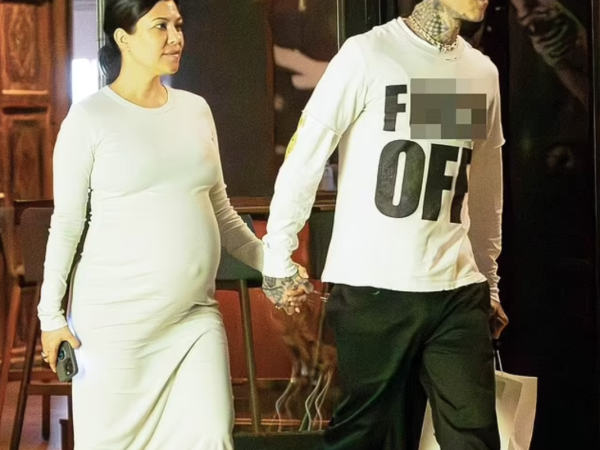 Kourtney Kardashian shows off her huge baby bump while holding hands with Travis Barker after vegan dinner date