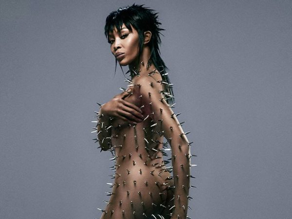 Supermodel Naomi Campbell poses nude with her entire body covered in silver spikes
