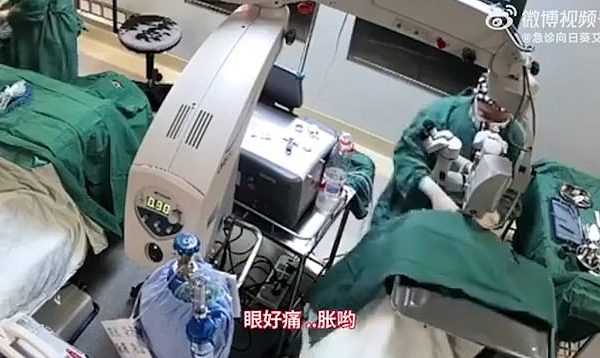 Moment doctor punches 82-year-old patient in the face three times while performing surgery on her eyes because she kept moving (Video)