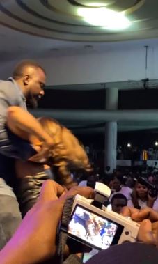 The Moment An Overzealous Fan Refused To Let Go Of Tiwa Savage On Stage (Video)