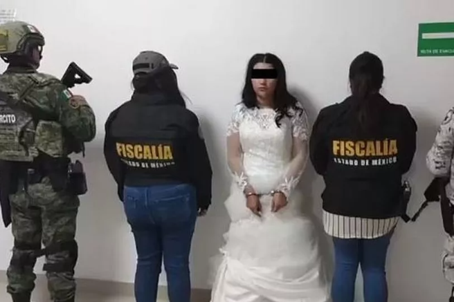 Bride is handcuffed and her mugshot taken in wedding dress before tying knot with cartel ‘mouse’