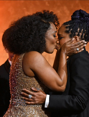 Angela Bassett and Regina King share a kiss at the Governors Awards