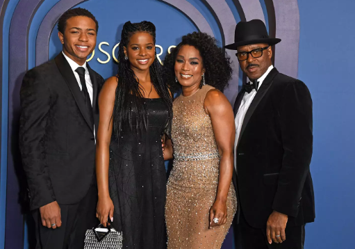 Angela Bassett and Regina King share a kiss at the Governors Awards