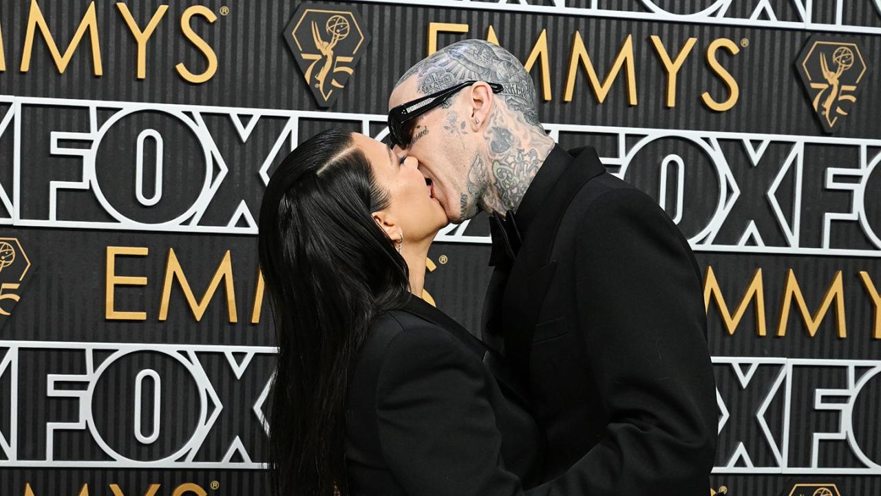 Kourtney Kardashian and Travis Barker share a passionate kiss at the Emmy Awards as she attends first public event since welcoming their first child (photos)
