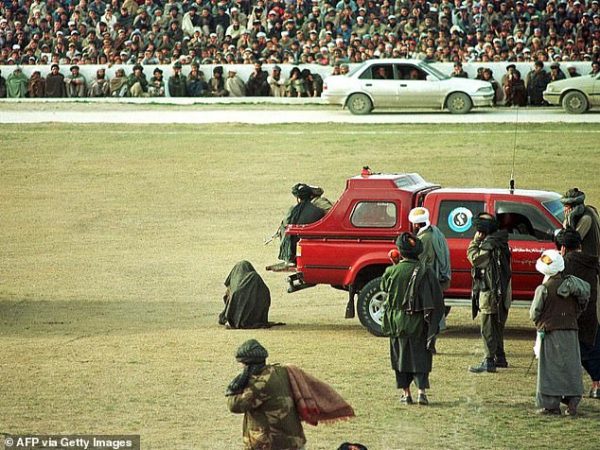 Taliban execute two murderers by machine-gunning them in front of thousands of spectators at football stadium
