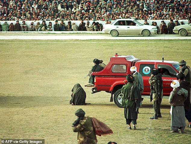 Taliban execute two murderers by machine-gunning them in front of thousands of spectators at football stadium