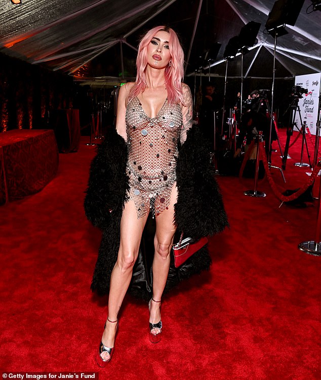 Actress Megan Fox goes topless beneath very racy chain metal top as she attends star-studded Grammys 2024 viewing party (Photos)
