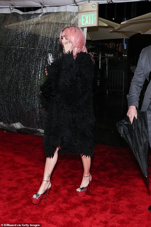 Actress Megan Fox goes topless beneath very racy chain metal top as she attends star-studded Grammys 2024 viewing party (Photos)