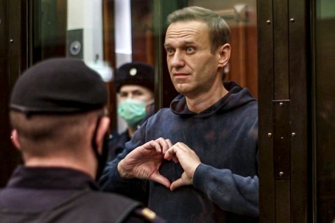 Putin critic Alexei Navalny’s corpse ‘driven away in midnight motorcade from prison’ in new footage
