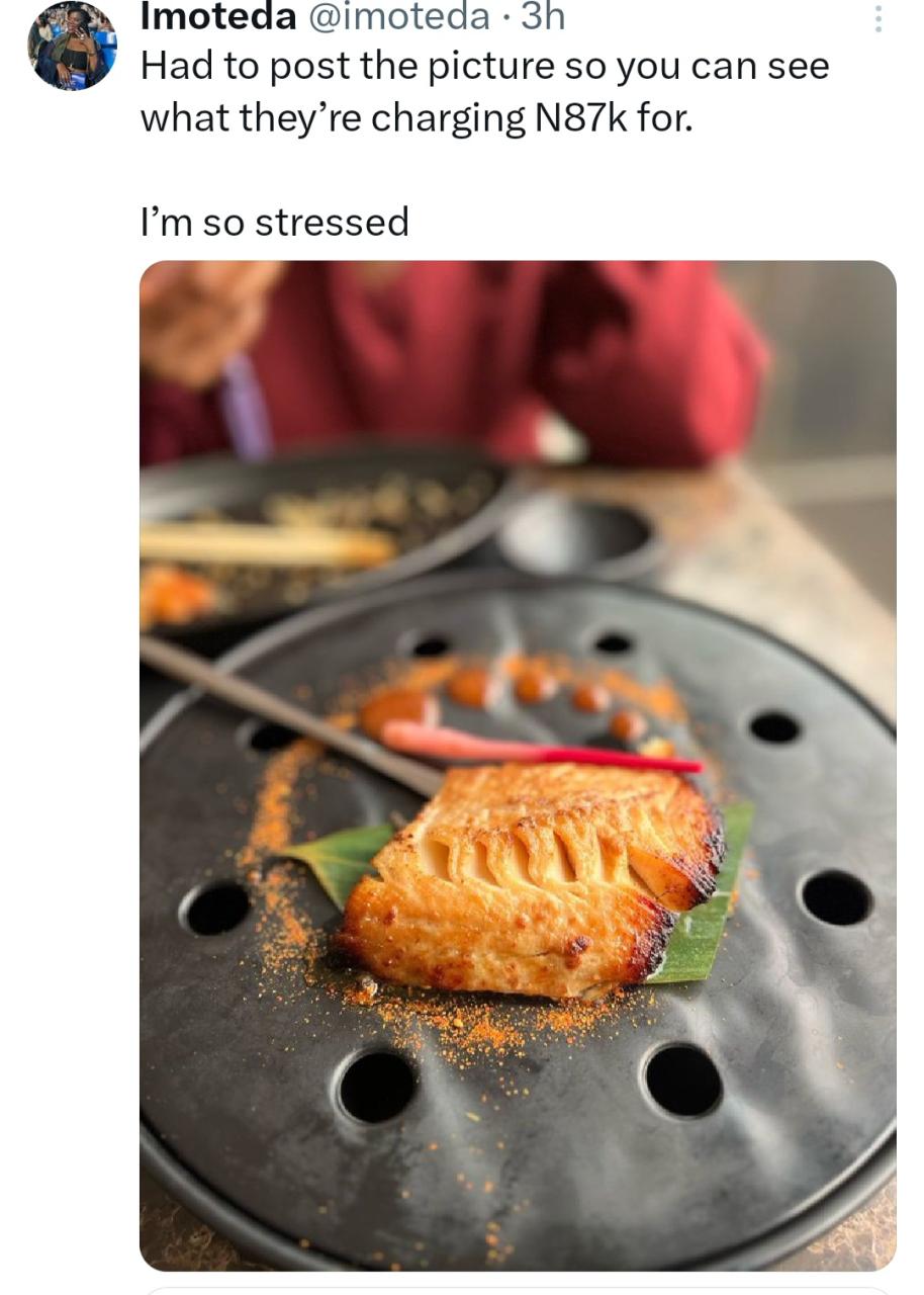 Customers show the size of fish they were charged N87k for at a Japanese restaurant in Lagos