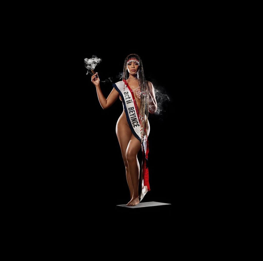 Beyonce strips down with only a sash covering her nudity as she advertises upcoming album