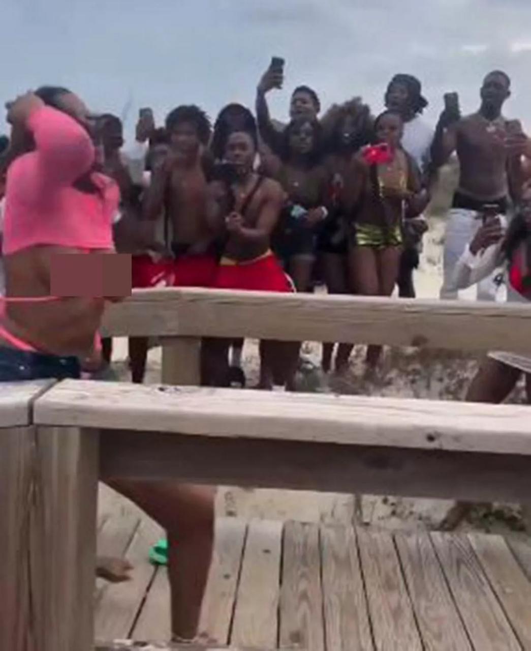 Breasts fall out of bikinis as women fight during spring break outing (photos/video)