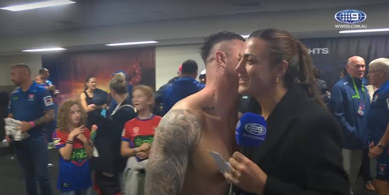 Moment footballer tries to kiss his teammate