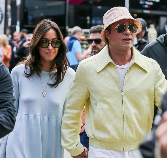 Brad Pitt and girlfriend Ines de Ramon hold hands at British Grand Prix in rare public outing