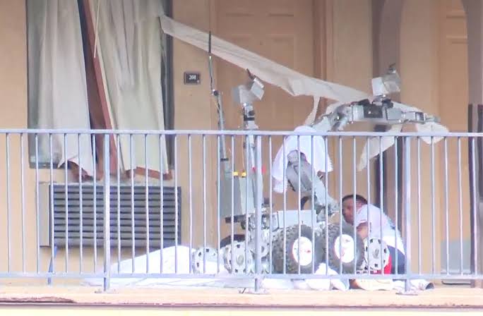Moment alleged criminal fighting police officers, gets tear-gassed and run over by a police robot (video)