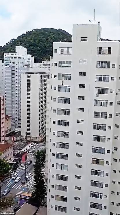 Cleaner left dangling from 16th-floor window after she slipped while cleaning (video)