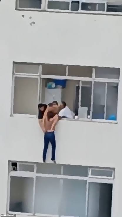 Cleaner left dangling from 16th-floor window after she slipped while cleaning (video)