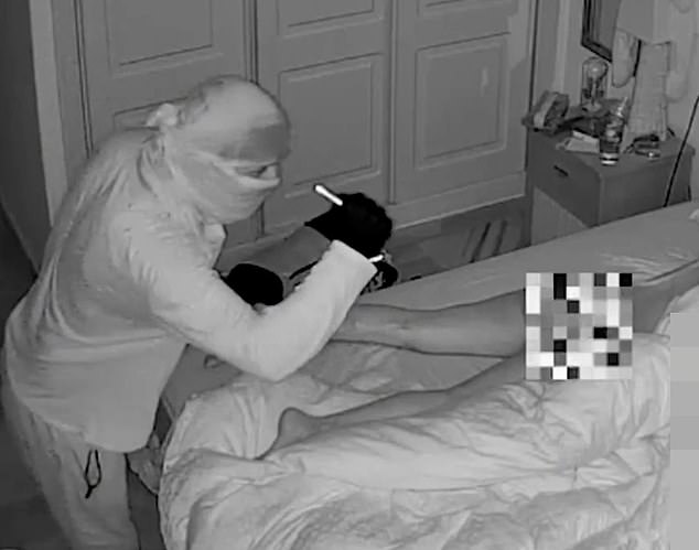 Chilling moment intruder inspects n@ked woman with his torch as she slept next to her partner