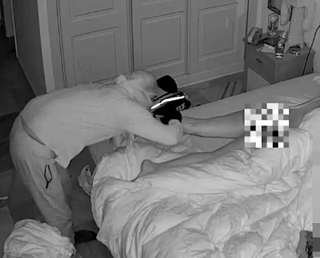 Chilling moment intruder inspects n@ked woman with his torch as she slept next�to�her�partner